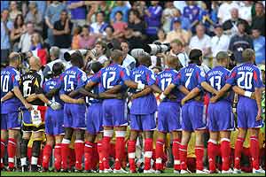 The French team stand for their national anthem
