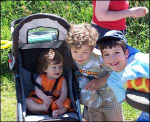 One-year-old Naomi with her brothers Jacob and David having a picnic in Morfa Nefyn (Wyn Morgan)