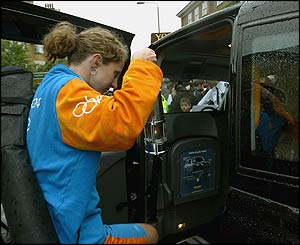 The flame is carried in a protective holder while being transported