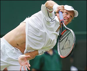 Thomas Johansson smashes a serve