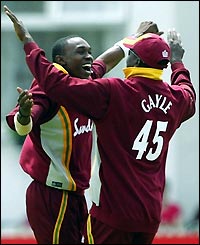 Chris Gayle celebrates with a team-mate