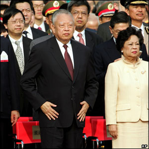 Hong Kong's leader Tung Chee-hwa, stands before a flag-raising ceremony to mark the seventh anniversary of Hong Kong's handover to Chinese sovereignty. 