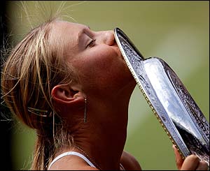 The 17-year-old kisses the famous trophy