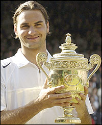 Federer with the Wimbledon trophy 