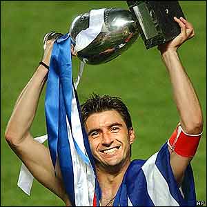 Greece captain Theodoros Zagorakis lifts the trophy 