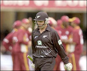 Nathan Astle walks from the crease