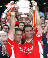 Skipper Kieran McGeeney called up Paul McGrane to accept the cup 