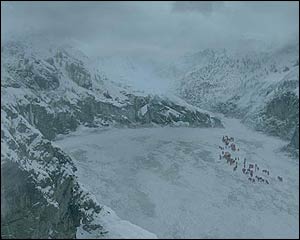 Computer matte paintings create the snowy valley while film of a fine spray creates the foreground mist.