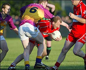 Johnny Mcbride of Derry in action against Wexford