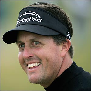 Phil Mickelson celebrates his eagle at the fourth