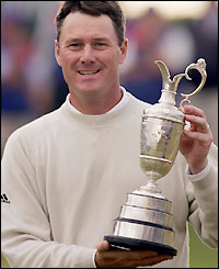 Ernie Els walks behind play-off opponent Todd Hamilton