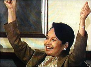 Gloria Macapagal Arroyo rejoices in Malacanang Palace in Manila moments after talking by phone to Filipino hostage Angelo dela Cruz following his release Tuesday July 20, 2004