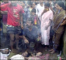 Relatives and neighbours of landslide victims in Assam