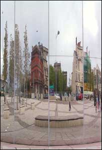 Reflected images in the tall silver water fall at Cardiff Bay (Howard Turvey)