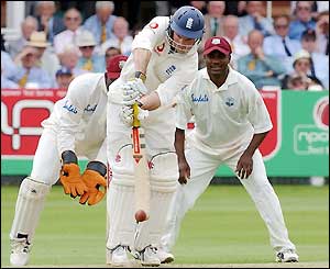 Andrew Strauss fends off a delivery as England take control