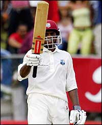 Chanderpaul celebrates his 50 and is 91 not out when the lunch break arrives as he continues to frustrate England 