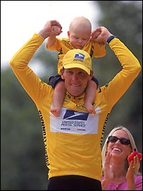 Lance Armstrong celebrates being race winner with son Luke after the final stage of the 2000 Tour De France