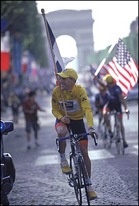 Lance Armstrong wins his third consecutive Tour de France on the Champs Elysees