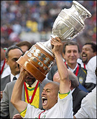 Alex lifts the trophy