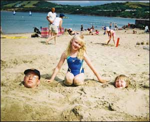 Vicky Stevens from Scotland sent this shot of her daughter Sammy burying her Dad and sister Susie in Newquay