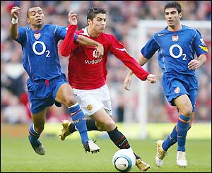 Portuguese winger Christiano Ronaldo looks to find a way through the Arsenal defence 