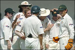 Australia's players congratulate Shane Warne