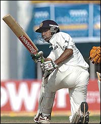 Mohammad Kaif sweeps the ball to leg