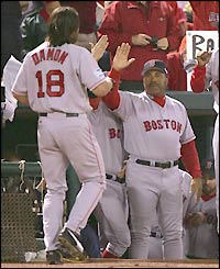 Johnny Damon is congratulated after completing his home run