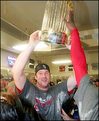 Opening pitcher Derek Lowe with the championship trophy
