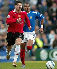 Portsmouth's Diomansy Kamara chases Christiano Ronaldo