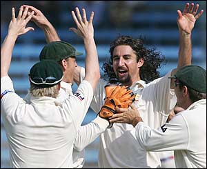 Australia's cricketers celebrate the dismissal of Mohammad Kaif