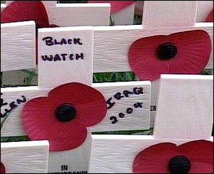 Relatives and friends planted tiny wooden crosses at the Field of Remembrance at Westminster Abbey.