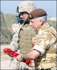British Army Col Tim Allen, commanding officer, National Liaison Headquarters (right), and Col Ronald J Johnson, commanding officer of the 24th Marine Expeditionary Unit, laid a wreath in Iraq.