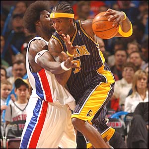 Detroit's Ben Wallace tries to guard Jermanine O'Neal of Indiana
