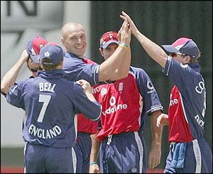 England's players celebrate the wicket of Zimbabwe's Brendon Taylor