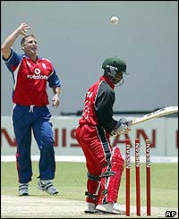 Zimbabwe captain Tatenda Taibu, right, is bowled out by England's bowler Darren Gough