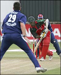 Ashley Giles bowls to Zimbabwe's Stuart Matsikenyeri