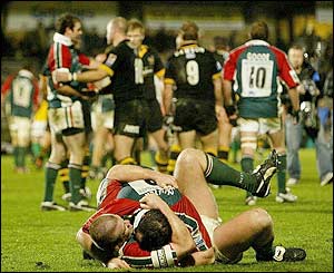Leicester's players celebrate at the final whistle