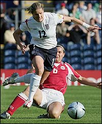 England's Kellly Smith of England is fouled by Louise Hansen