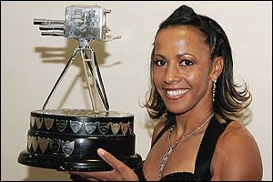 Kelly poses with the trophy