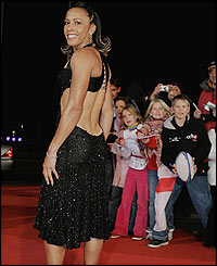 Kelly Holmes in a stunning black backless dress