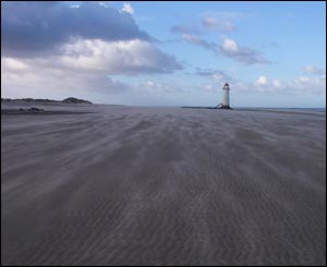 A windy day at Talacre Beach near the lighthouse, sent by Bryony Taylor from Dyserth in morth Wales.