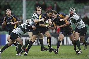 Thomas Lombard is tackled by Mike Catt