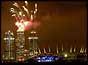 Fireworks over Canary wharf with Millennium Dome to right of pic