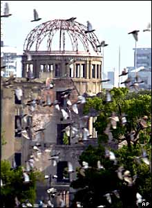 Doves fly over the Atomic Bomb Dome
