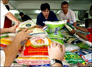 Malaysian Buddhist volunteers load food supplies at a temple in Kuala Lumpur.