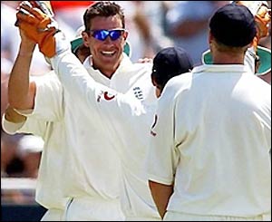 Ashley Giles claims his first wicket of the match as Smith departs for 74
