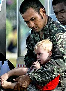 Thai soldier with child
