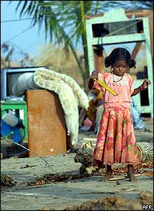Little girl in Kallar, southern India, plays in a courtyard