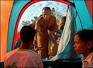 Buddhist monks distribute aid